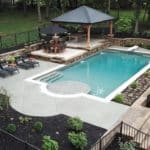 small cocktail vinyl liner pool in backyard with diving board