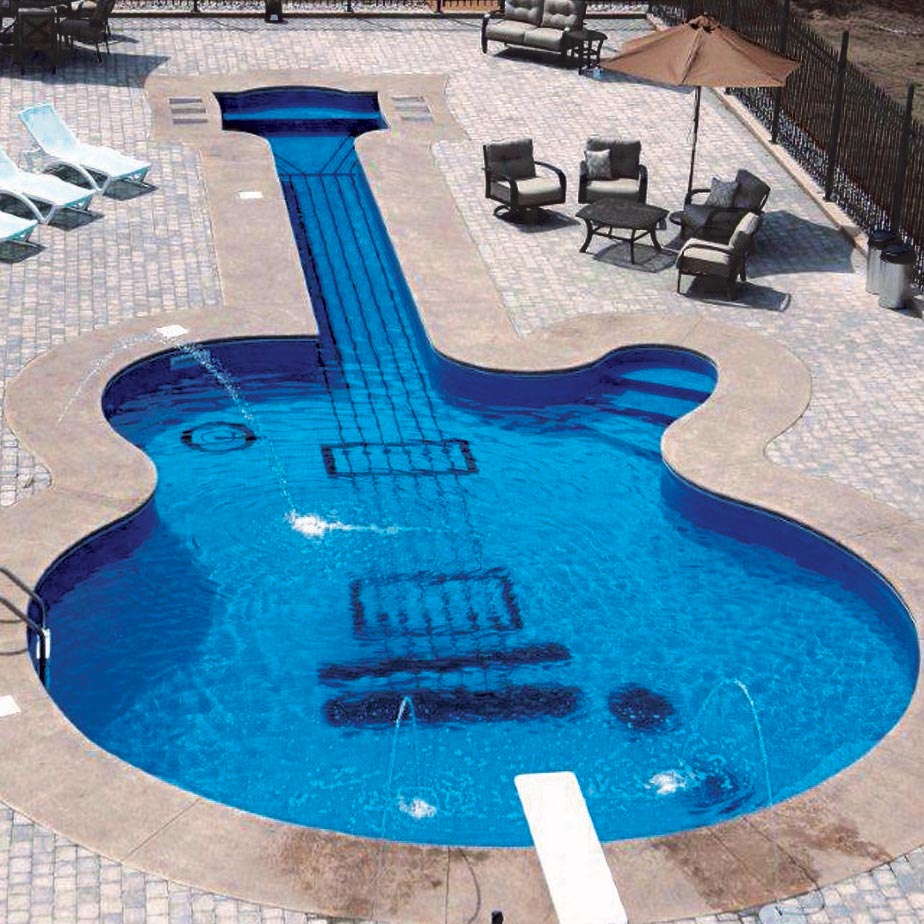 Guitar Shaped Swimming Pool with surrounding patio area