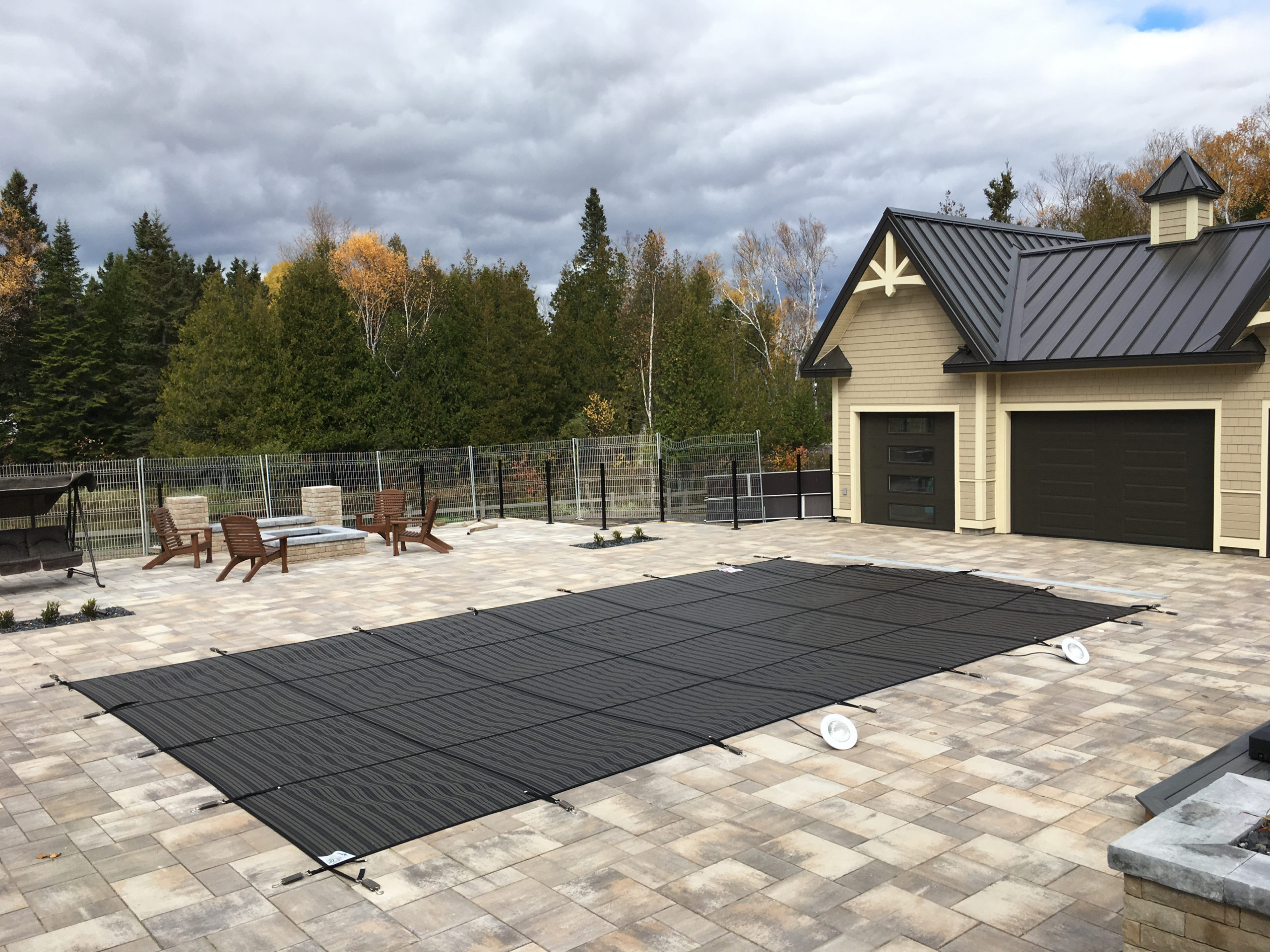 mesh safety cover on winterized inground pool 