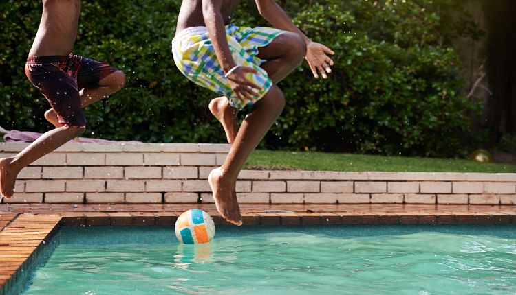two-kids-jumping-pool.jpg
