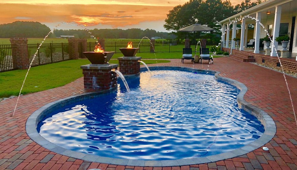 Water Features and Fire Bowls Around a Fiberglass Pool