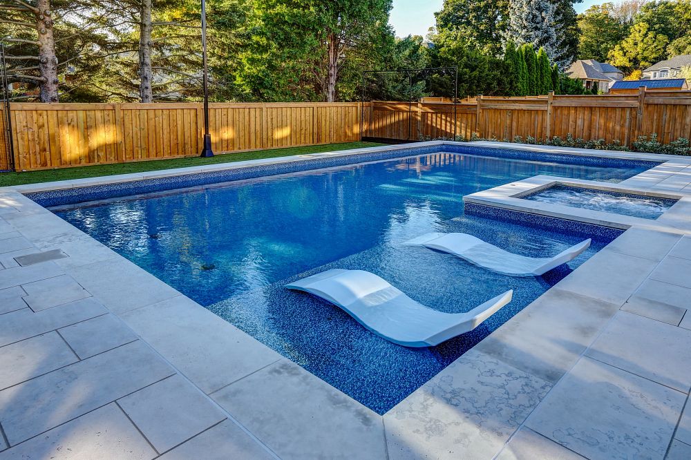 colorful vinyl liner pool with swim-up seating in suburban backyard