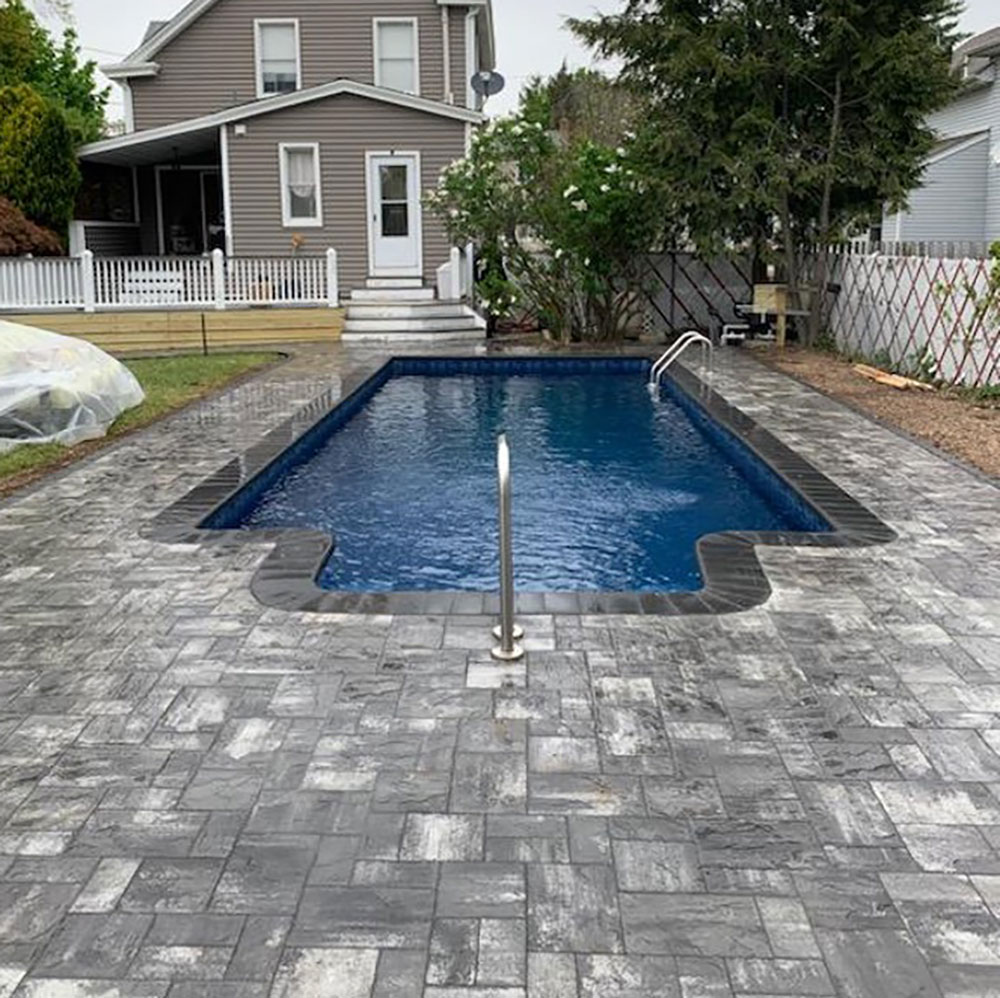 Rectangle vinyl liner pool with a new liner and new gray decking