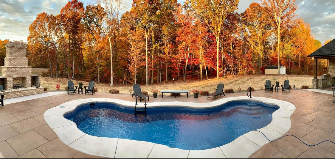 freeform pool in a North Carolina backyard in the fall