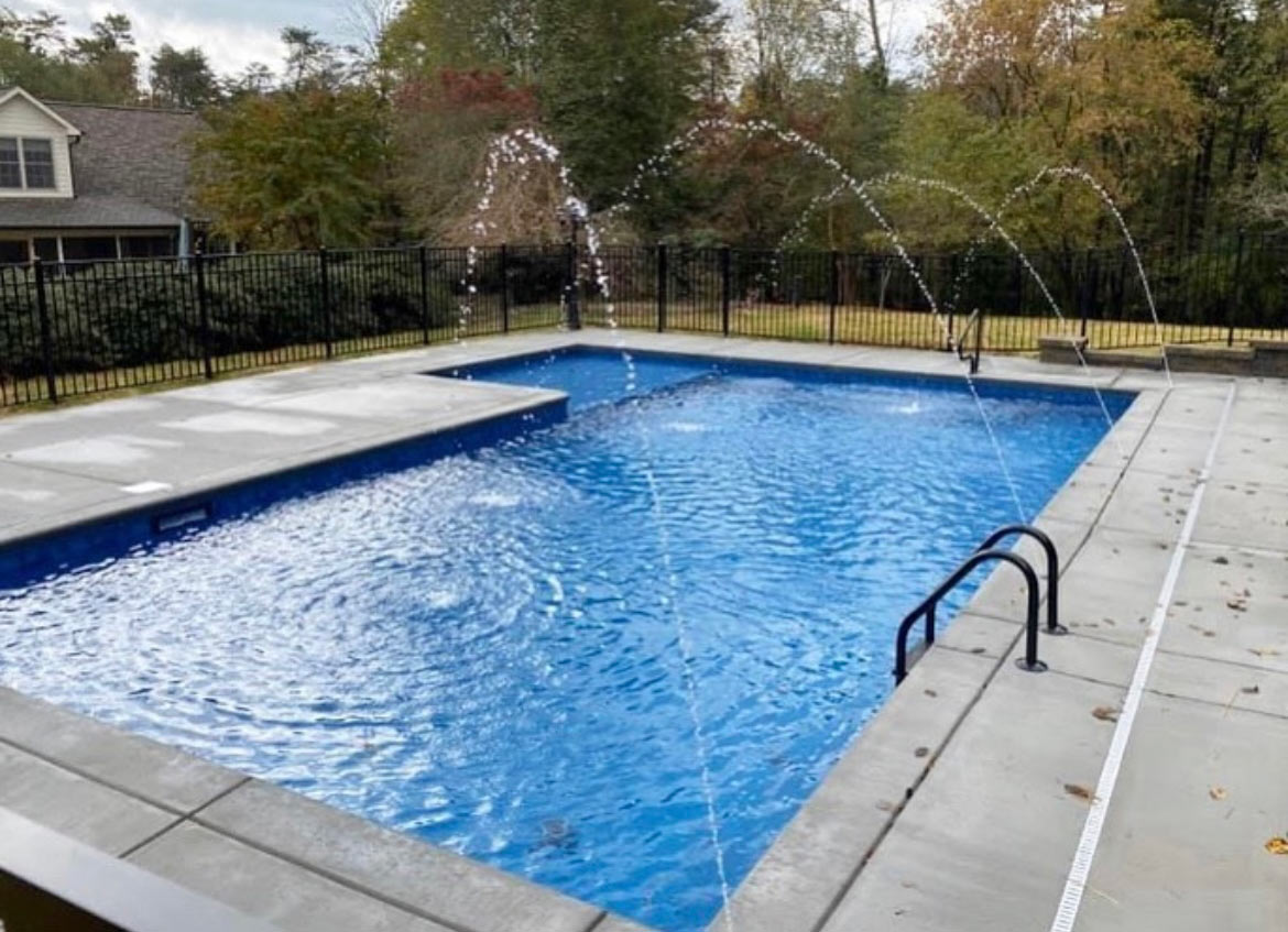 rectangular fiberglass pool in a North Carolina backyard