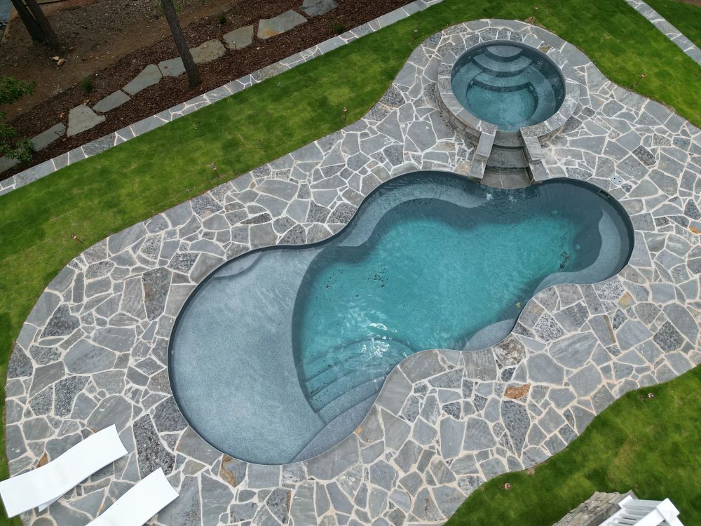 fiberglass freeform shaped inground pool with spa