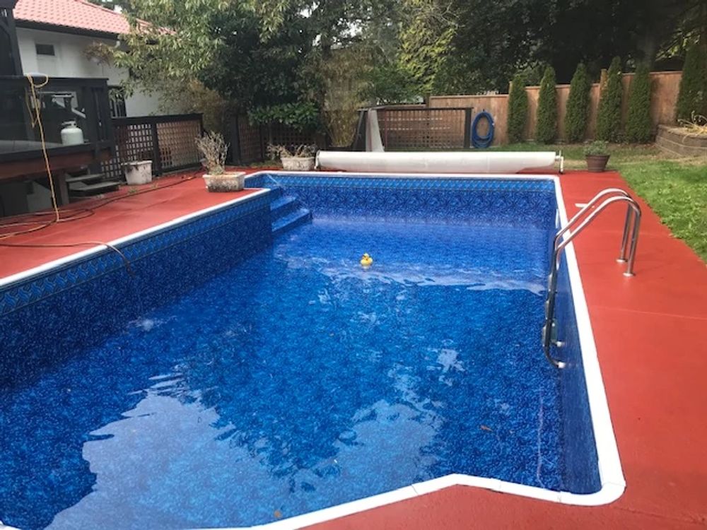 custom shape pool with red deck