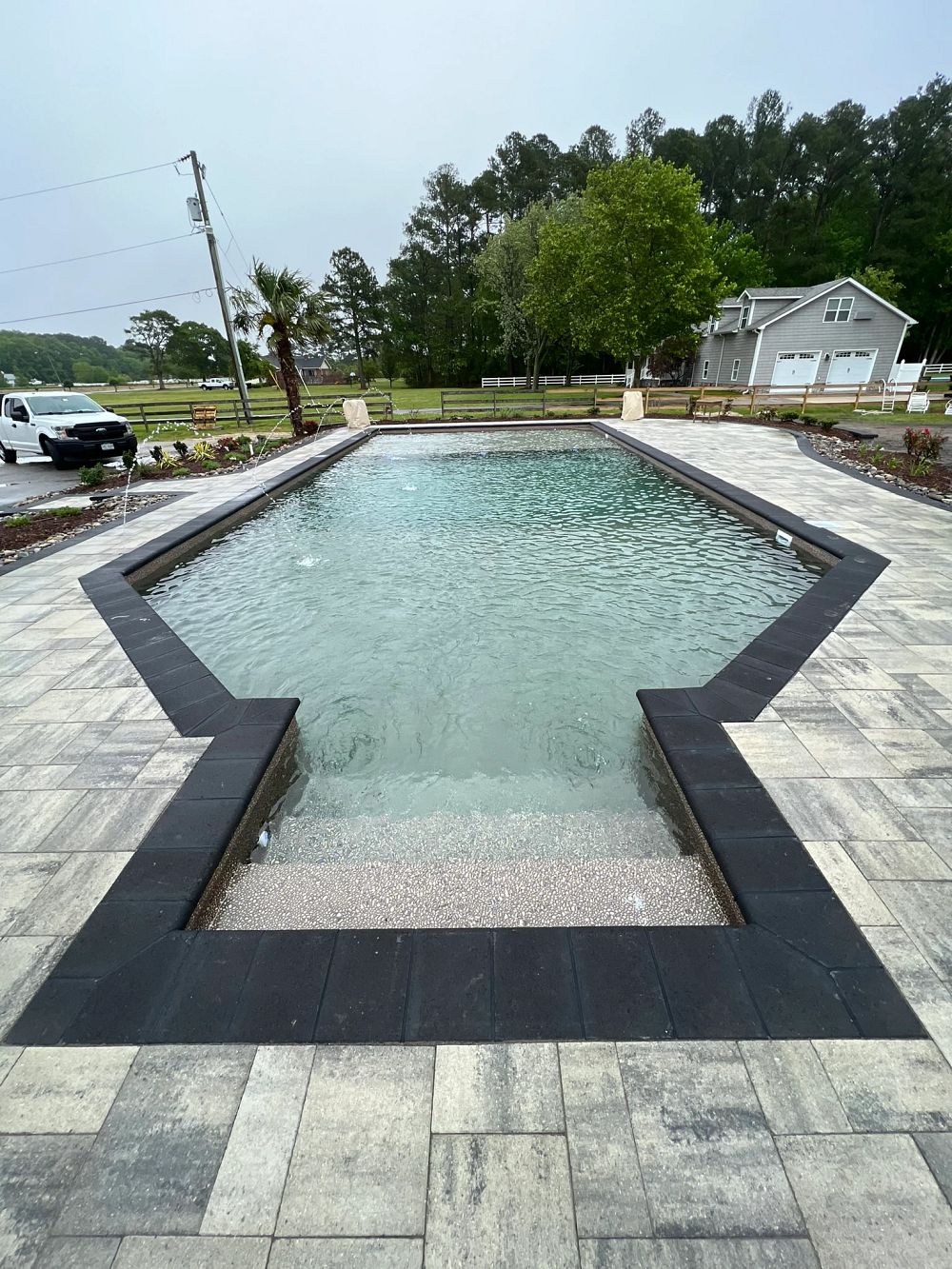 vinyl liner pool in Virginia backyard with custom water features