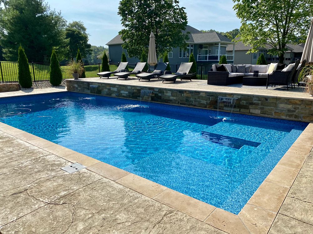 rectangular vinyl liner pool in a sloped Illinois backyard