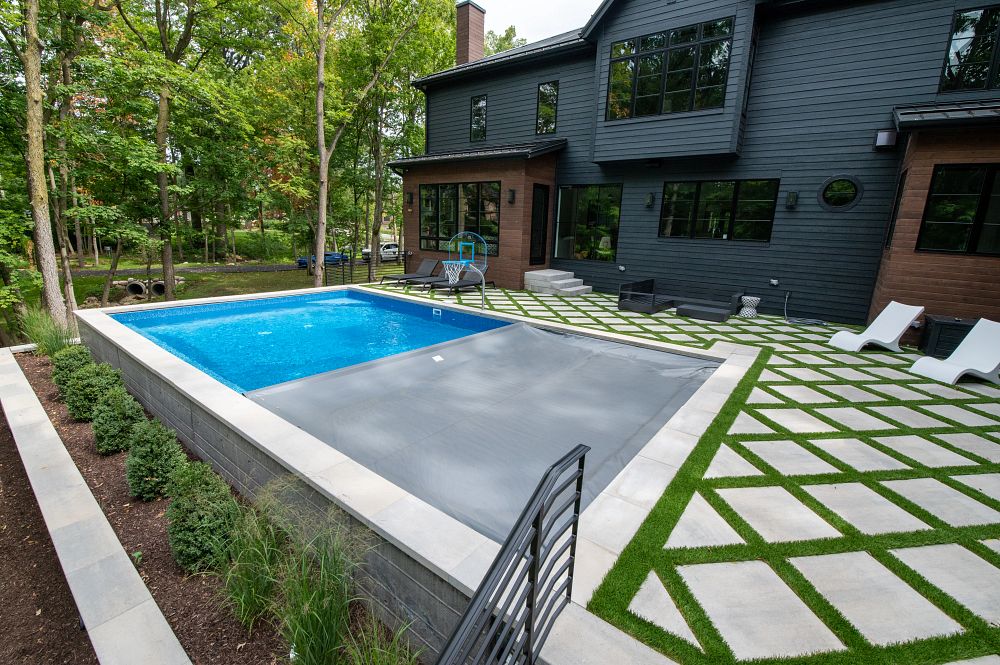 small, rectangular pool in irregularly shaped Illinois backyard