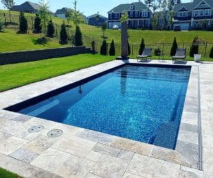 fiberglass pool built on a slope in an irregularly shaped South Carolina backyard