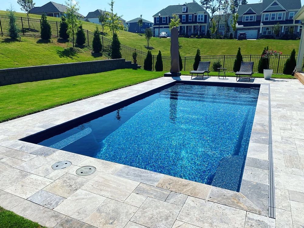fiberglass pool built on a slope in an irregularly shaped South Carolina backyard