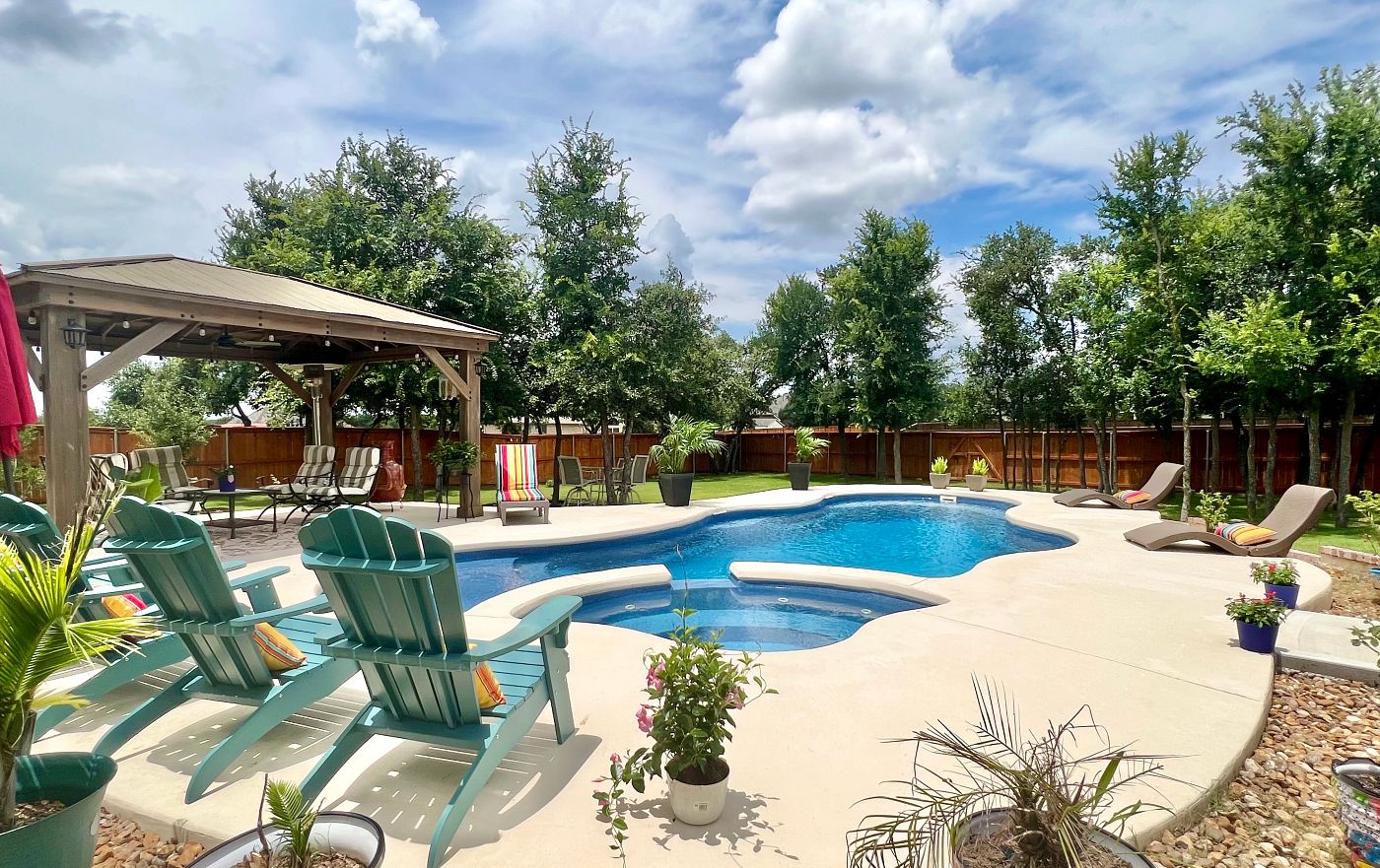 fiberglass pool and spa in large southern backyard