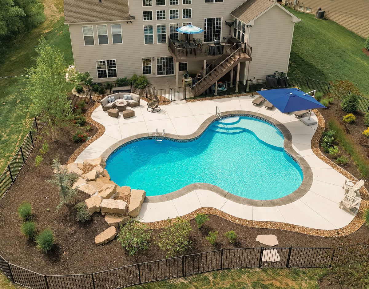 large vinyl liner pool in sloped Missouri backyard