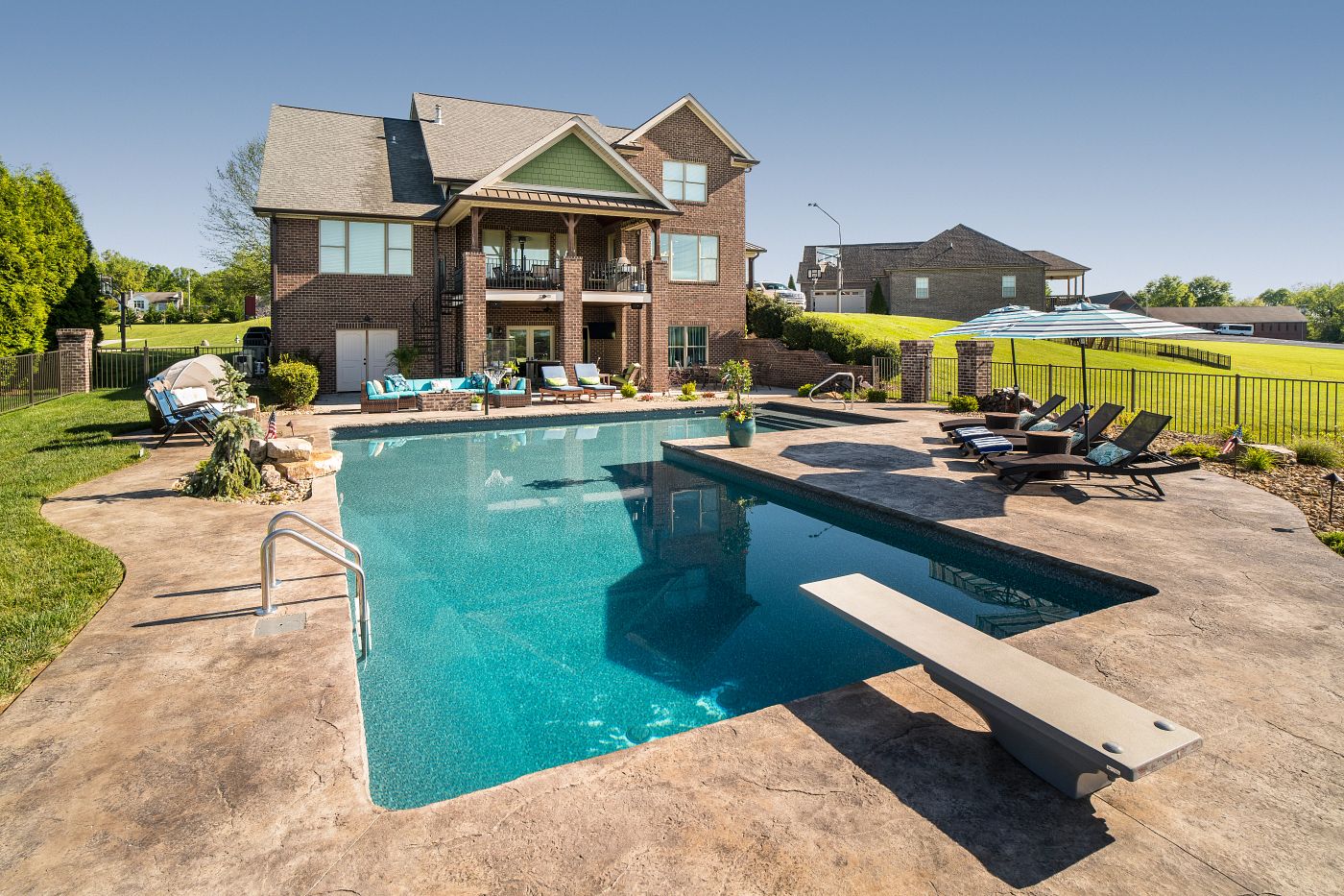 large vinyl liner pool in southern backyard on a hill