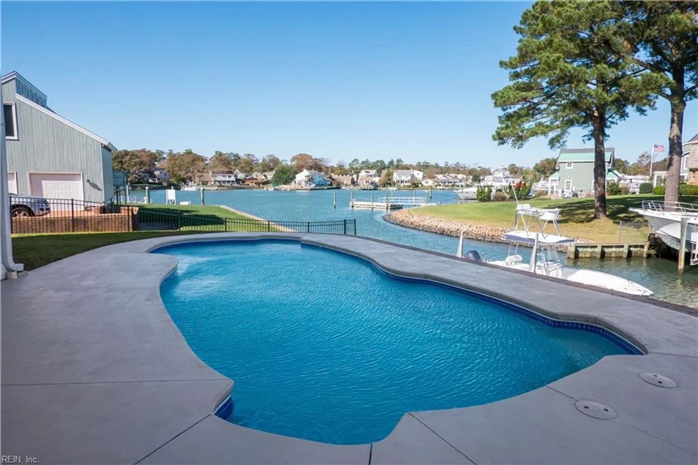 vinyl liner pool in northeast backyard by a bay