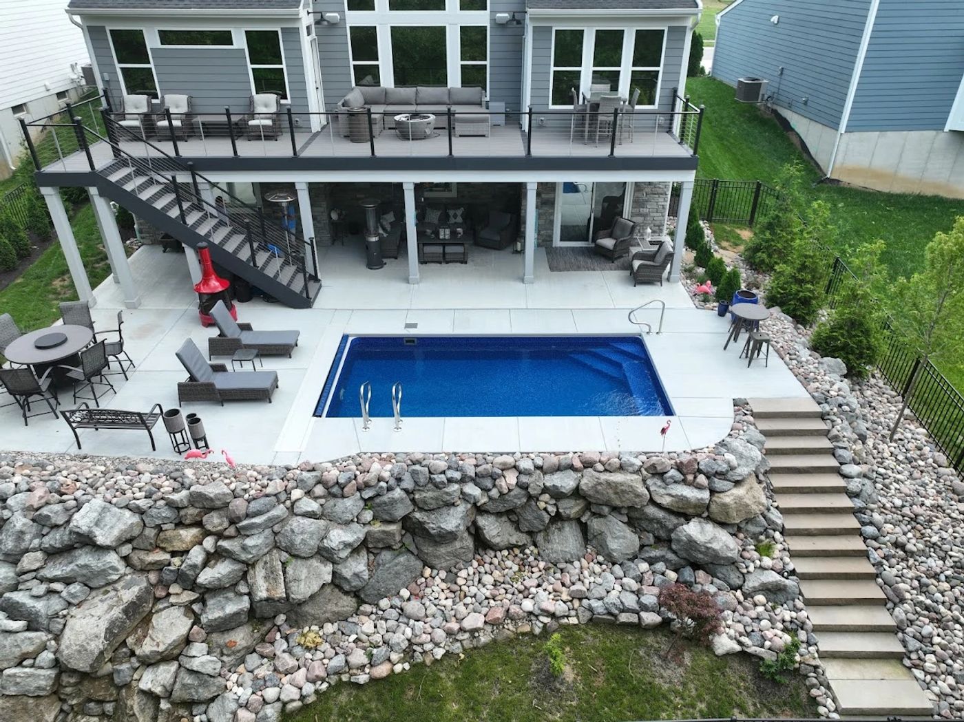 vinyl liner pool built in a small northeast backyard on a hill