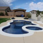 fiberglass pool in a freeform shape in a Nevada suburban backyard