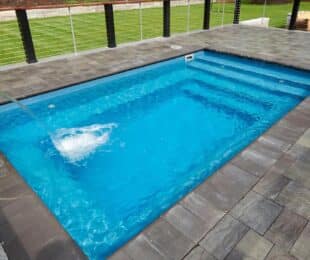 View of a compact plunge pool in a backyard