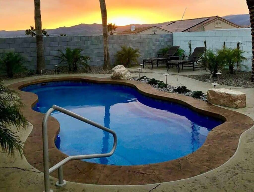 freeform fiberglass pool in desert settin