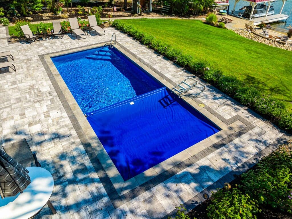 Latham Fiberglass pool and Coverstar Autocover | Photo courtesy of Concord Pools & Spas, NY